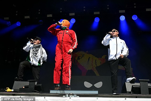 The group was originally shown on the BBC to avoid televising the set from anti-Israel, Irish-language rap group Kneecap (pictured)