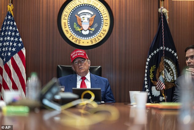 In this image provided by the White House, President Donald Trump and Secretary of State Marco Rubio, right, sit in the Situation Room, Saturday, June 21, 2025, at the White House in Washington