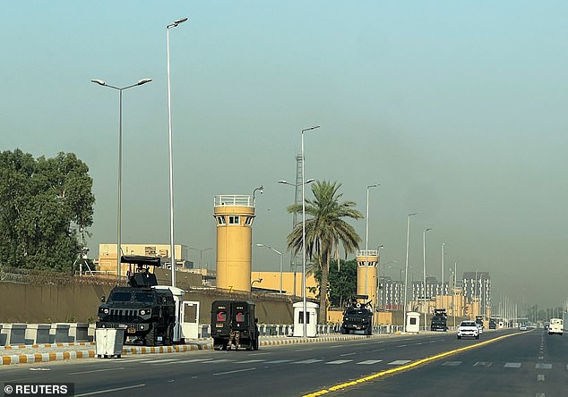 Armored vehicles belonging to Iraqi security forces are stationed outside the U.S. Embassy in Baghdad's Green Zone, Iraq, June 12, 2025