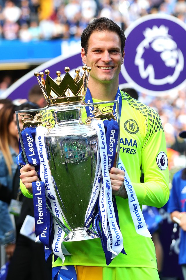 Asmir Begovic of Chelsea holding the Premier League trophy.