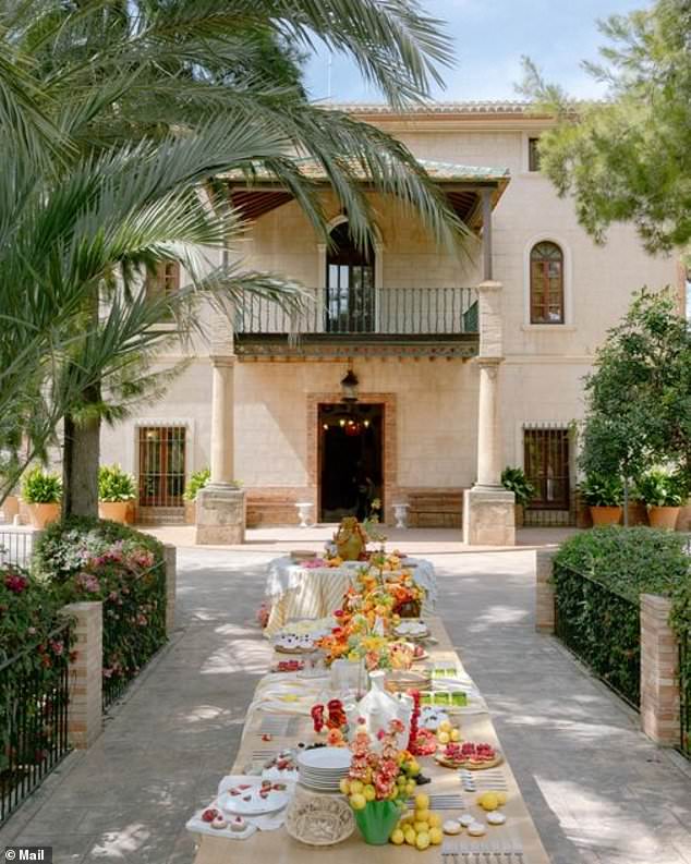 The dining table at El Senyoret, a restored farmhouse known for tasteful banquets and parties looking out over the Serra Gelada natural park