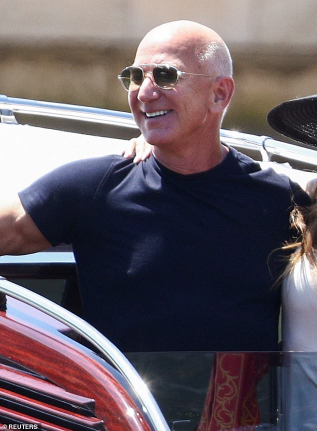 Jeff Bezos, 61, continued with his understated ensembles today in a lackluster combination of a tight black T-shirt and light grey pants for his water taxi journey around the Venetian canals with his new bride