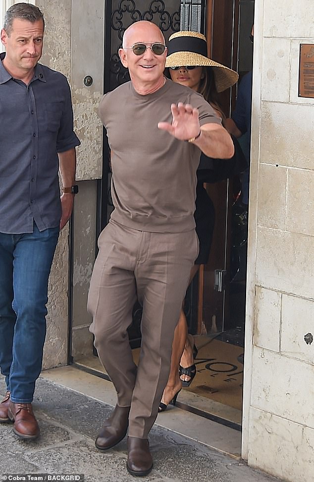 Groom Jeff Bezos, 61, went for a monochrome all-brown look on the morning after his wedding which distracted from his new bride. The billionaire tech mogul's outfit choice felt more fall than summer as the newlyweds strolled through the streets of Venice hand in hand