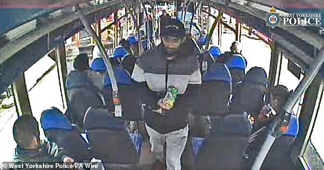 Masum (centre) on a bus prior to him attacking his wife
