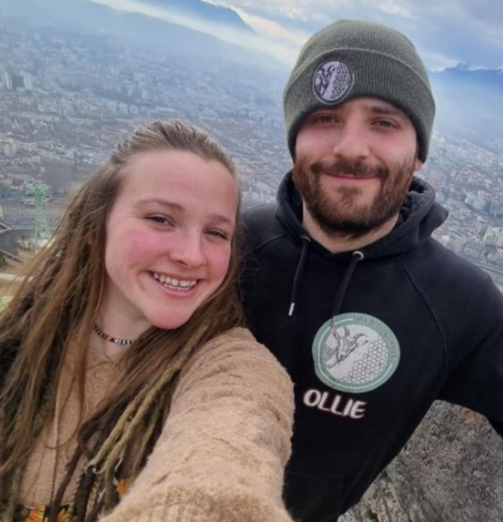 Selfie of a couple overlooking a city.