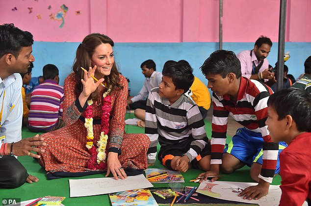 The Princess of Wales meets children at the Salaam Baalak Trust centre in New Delhi railway station in India, where the charity provides food, education and healthcare to the needy