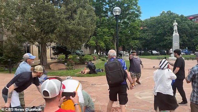 Police were quick to respond jumping into action and pinning down the suspect on the grass