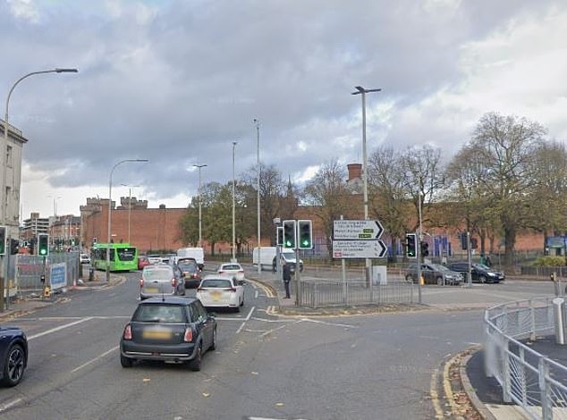 A woman in her 50s has died after she was allegedly assaulted in the street by a BMW driver who had just flipped his car in a horror crash. General view of the scene