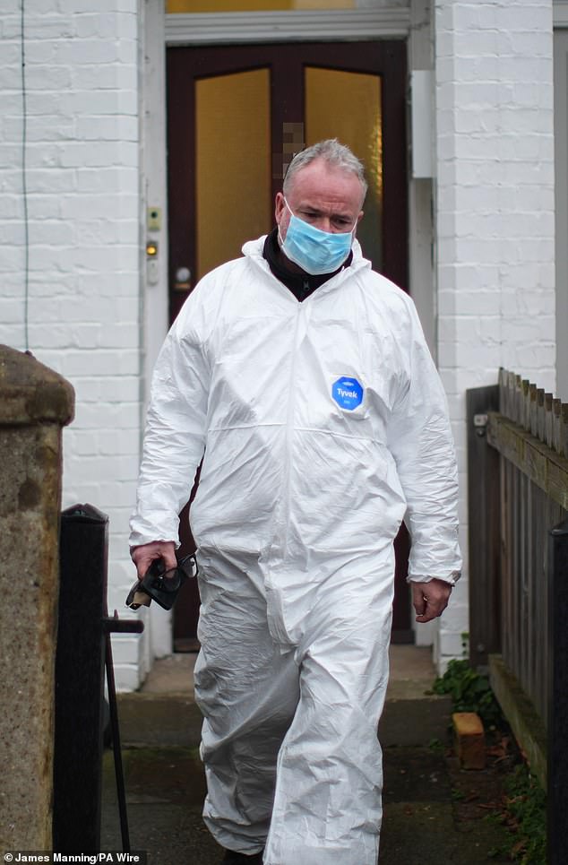 The Old Bailey heard that the victim had suffered a brutal attack, sustaining at least 10 separate injuries to the back and side of her head after being repeatedly struck with a mallet (Pictured: forensic officers at the scene)