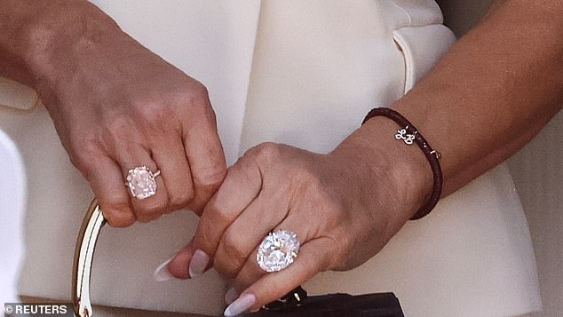The 30-carat $3 million pink diamond, presented by Bezos when he asked her to marry him two years ago, had been switched to her right hand... and in its place a yet larger, brilliant-white diamond, estimated at 35 carats and worth $8-$10 million