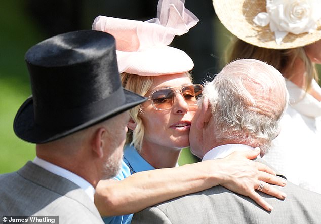 Zara Tindall pecks the King on the cheek as she warmly greets her uncle at Royal Ascot