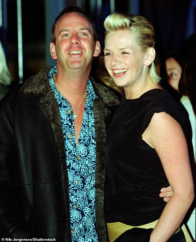 The Radio 2 presenter, 54, was spotted strolling hand-in-hand with the mystery man while enjoying the music at Glastonbury on Friday (pictured with Norman in 2001)