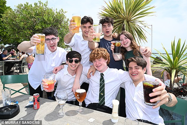 Just after midday, seven 18-year-olds, from the town’s Chatham & Clarendon Grammar School, celebrate having finished their final A-level (religion and philosophy)