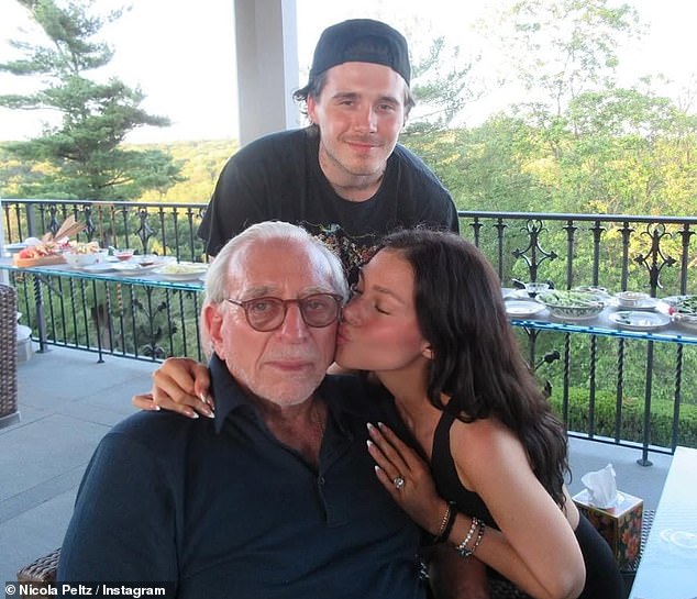 Brooklyn looked right at home with his in-laws, happily posing with Nelson and Nicola's brothers at the party held at the Peltz family's huge home in Bedford, New York