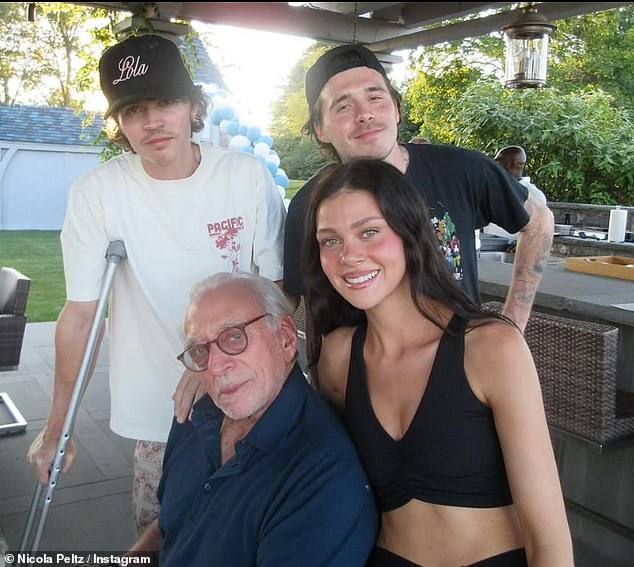 Brooklyn smiled as he posed with his beaming wife, his father in law Nelson and brother in law Will Peltz