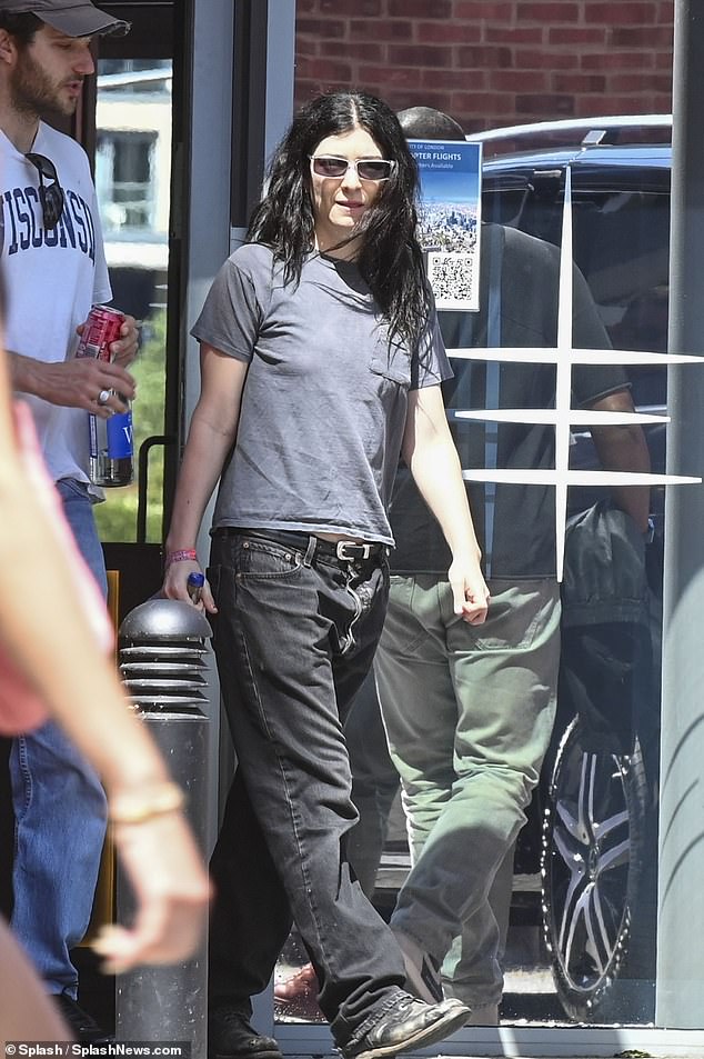 Lorde went casual for the trip, wearing a light great T-shirt