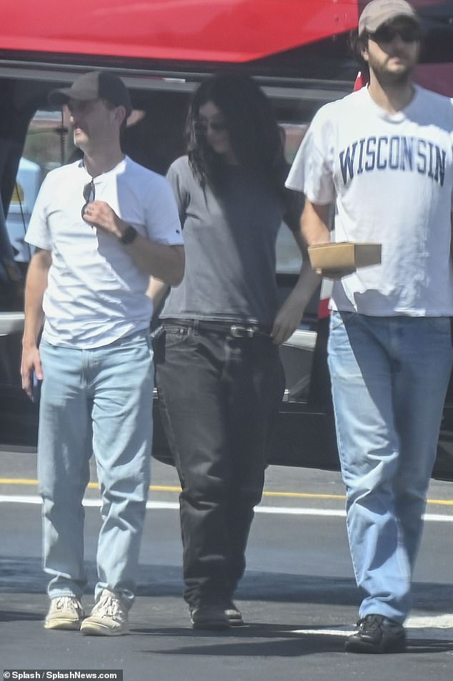 The producer and DJ, who has worked with the likes of Haim, Bon Iver and Empress Of, also wore  a white 'Wisconsin' T-shirt and a pair of light blue jeans