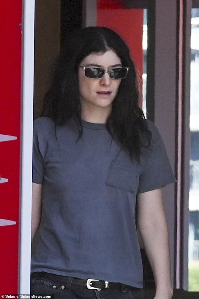 The pop star wore her raven locks down, leaving her long tresses to fall freely over her svelte shoulders