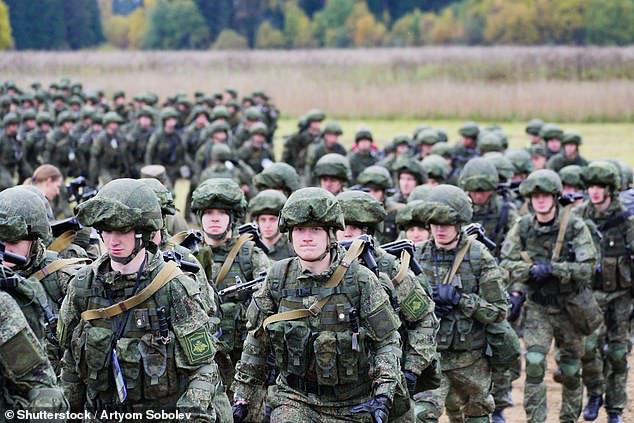 Pictured are Russian troops from across the country taking part in a march
