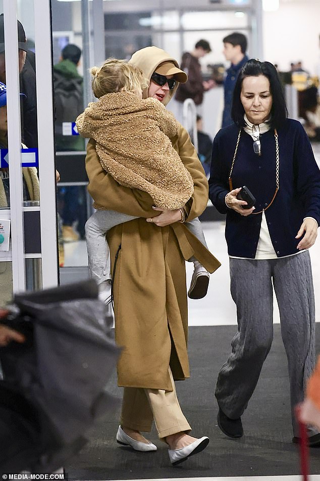Despite the breakdown of her nine-year relationship, Katy smiled as she cuddled Daisy