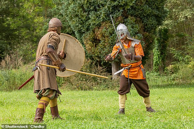 The castle, which is run by the National Trust, often hosts groups of volunteers with a passion for history and training (Pictured: Stock image of a medieval battle reenactment)