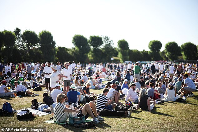Tennis fans line up hoping for admission on the first day of the 2025 Wimbledon tournament