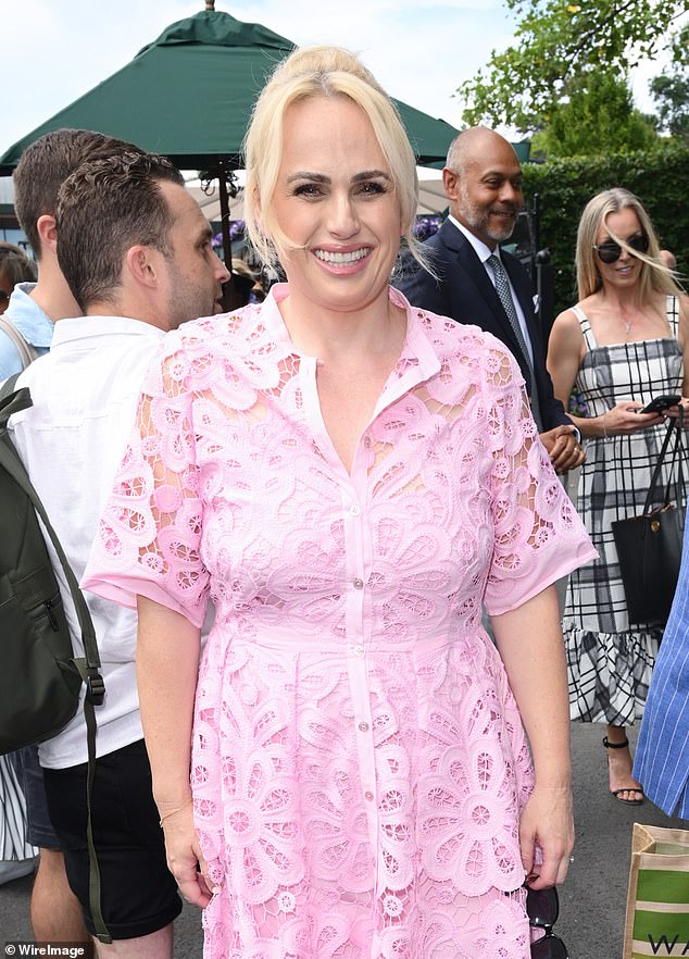 Rebel flashed a dazzling smile as she caught the eye in her pretty pink number