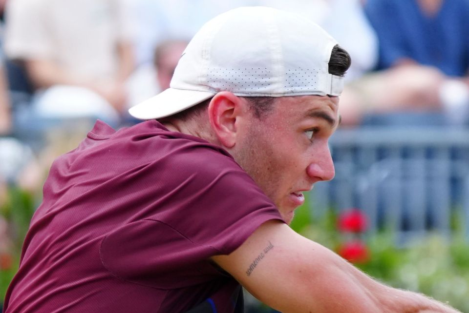 Close-up of Jack Draper's arm showing a tattoo that reads "someone said".