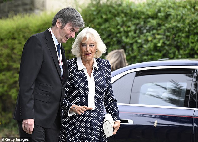 Queen Camilla is greeted by Lord Lieutenant Sir Ian Rankin whilst arriving to officially open Ratho Library in Newbridge