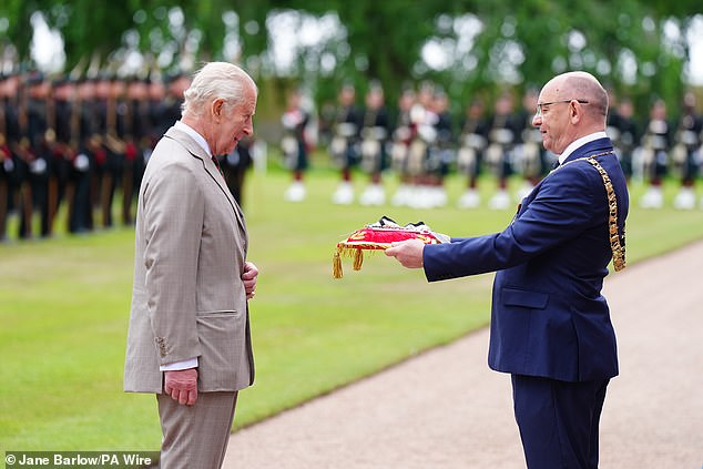 The Lord Provost of Edinburgh Robert Aldridge (right) presents the keys to the City of Edinburgh to King Charles III during the Ceremony of the Keys in the gardens of the Palace of Holyroodhouse