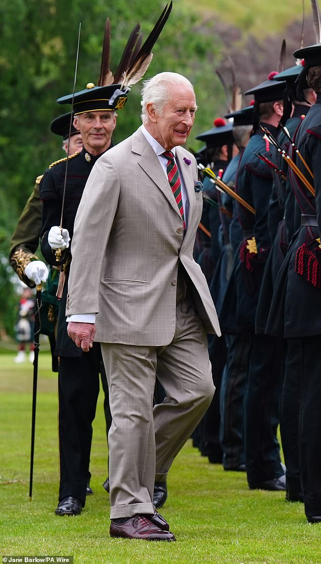 The King walked past the Guard of Honour, casting his eye over the service personnel and stopping to talk to some of them, and he also chatted to members of the military bands