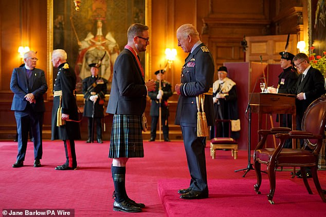Christopher Stark, from Glasgow, Chief Executive, Climate Change Committee, is made a Commander of the Order of the British Empire by King Charles III during an investiture ceremony at the Palace of Holyroodhouse, Edinburgh. The honour recognises services to tackling climate change