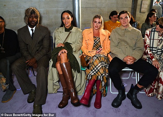 Last September, Draper (right) attended London Fashion Week alongside Skepta (far left), and Olympians Katarina Johnson-Thompson (second from left) and Keely Hodgkinson (in orange)
