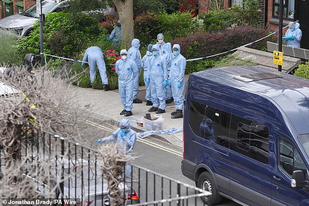 Forensic officers at the couple's address in Shepherd's Bush, west London, after human remains were found in two suitcases near the Clifton Suspension Bridge in Bristol