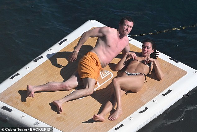 Callum displayed his sunburnt chest and back while wearing a pair of bright orange swimming trunks