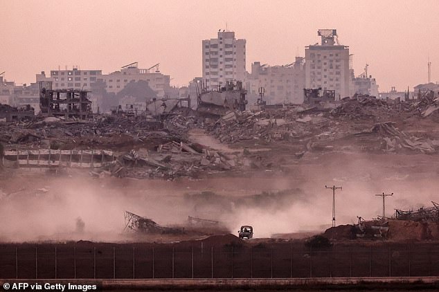 This picture taken from a position on the Israeli border with the Gaza Strip, shows an Israeli vehicle returning from the Palestinian territory on July 1, 2025