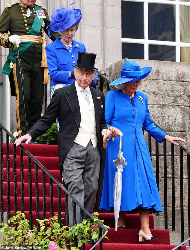 Princess Anne followed Charles and Camilla as they walked down the stairs into the garden party