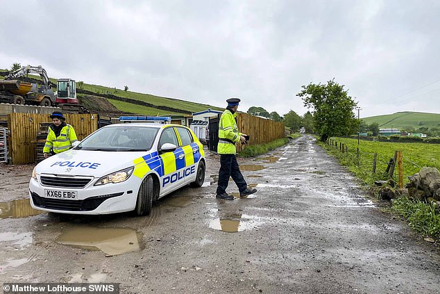 - Police at the scene in Milnrow, Rochdale on May 16 2022.