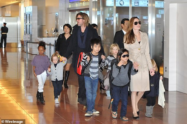 Their relationship ended after an alleged physical altercation involving their kids on a private plane in 2016; pictured November 2011 in Tokyo
