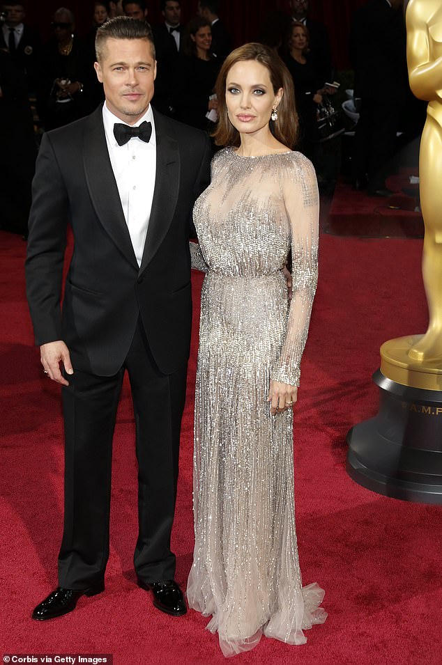 Pitt and Jolie were previously together for 12 years, from their meeting in 2004 up until Jolie filed for divorce in 2016. They were married for two of those years; pictured March 2014 in Hollywood