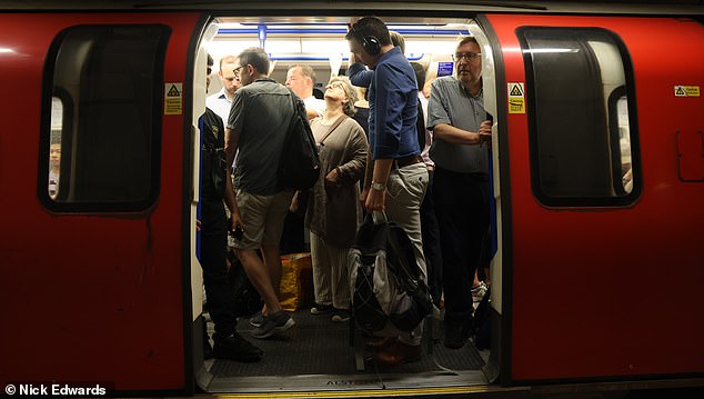 Commuters endure very hot conditions on the London Underground network yesterday morning
