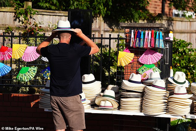 A person buying a Panama Hat on day two of the 2025 Wimbledon Championships yesterday