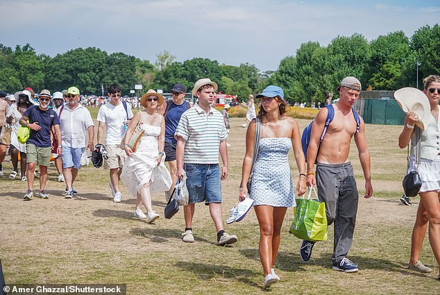 Tennis fans queuing in the scorching heat on day two of the Wimbledon Championships yesterday