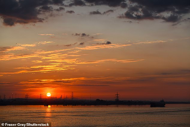 A beautiful sunrise over the River Thames at Gravesend in Kent early yesterday morning