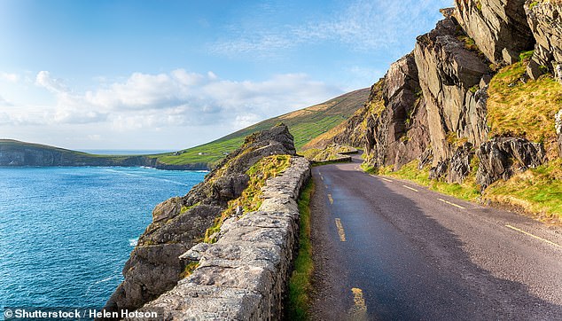This amazing road trip takes holidaymakers from the Inishowen Peninsula in County Donegal to Kinsale in County Cork, claiming the title of the world's longest defined coastal route. Pictured: Slea Head Drive on the Dingle Penisula in County Kerry on the west coast of Ireland