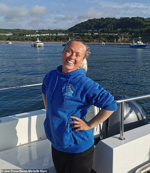 Pictured: Sarah, a spokesperson for Dolphin Spotting Boat trips. Experts have been left baffled by Anakin's behaviour