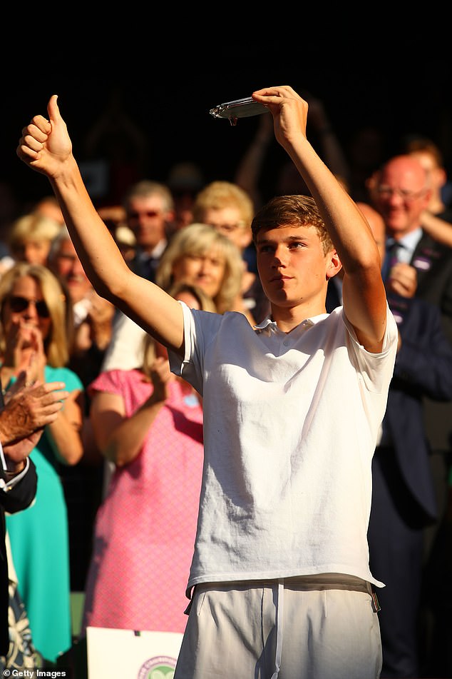 Draper, pictured here as a teenager after finishing runner-up at the boys' singles, had a late growth spurt and has bulked up massively