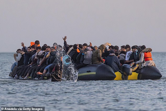 Pictured: Migrants attempting to cross the English Channel in a small boat in Gravelines, France, on June 30