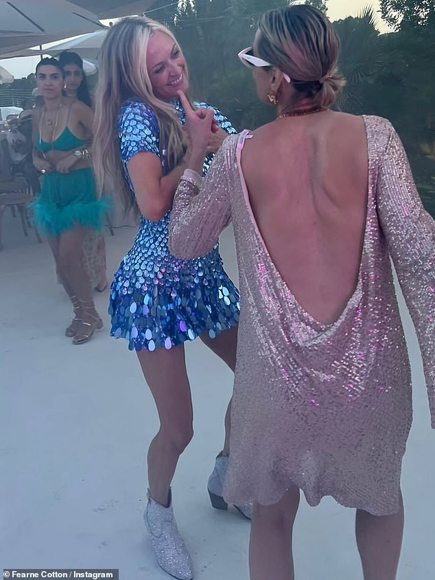 She completed the eye-catching outfit with silver boots and matching jewellery