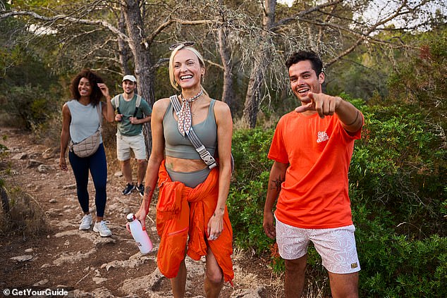 Other behind the scenes photos showed Fearne getting the giggles while deep in conversation with handsome Pablo Leonard, co-founder of Into The Island, who was showing her the sights